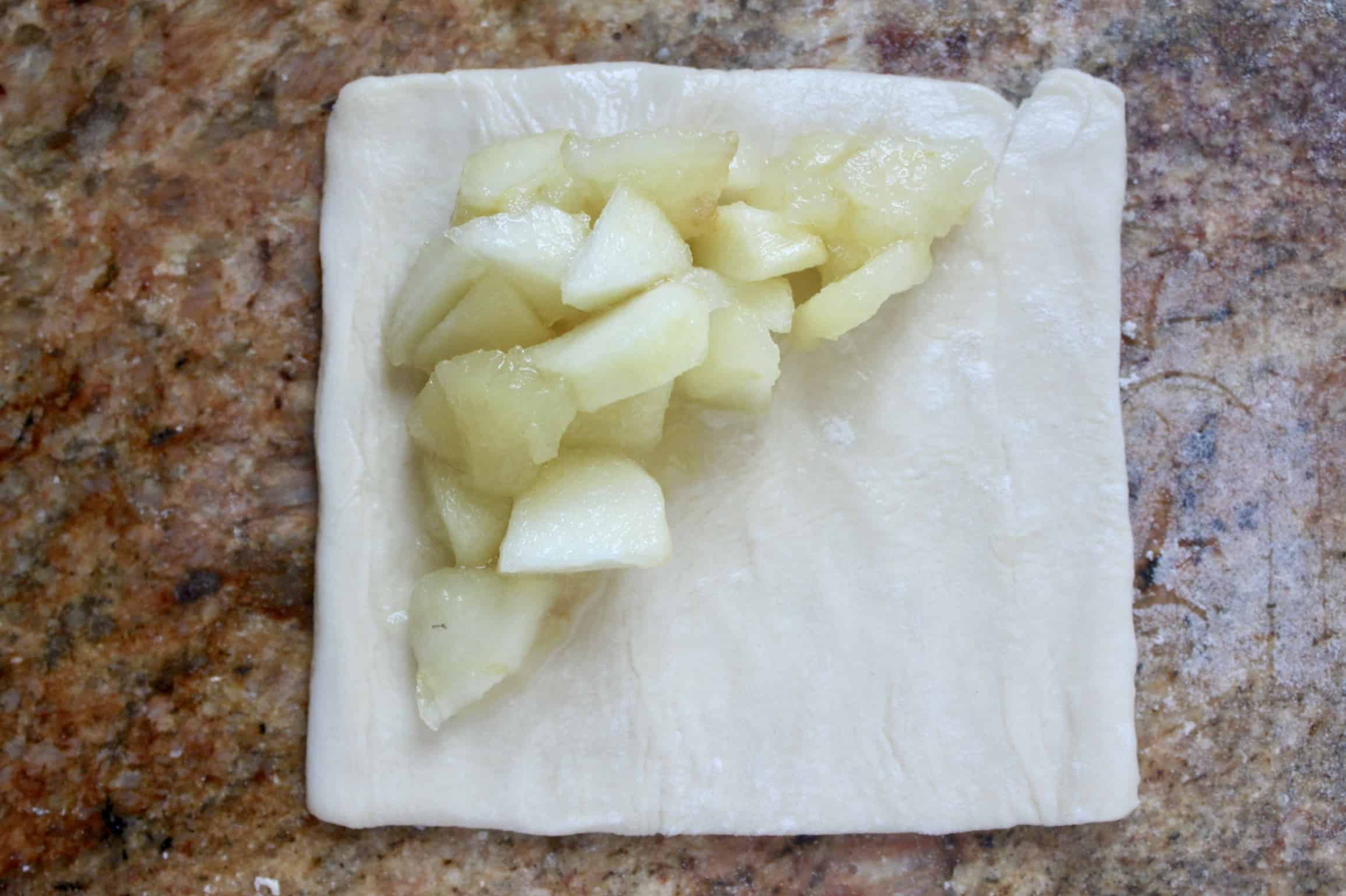 apple filling on a square of puff pastry