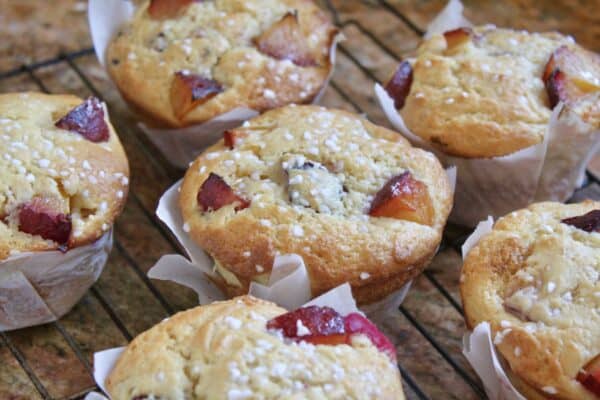 perfect plum muffins on a cooling rack