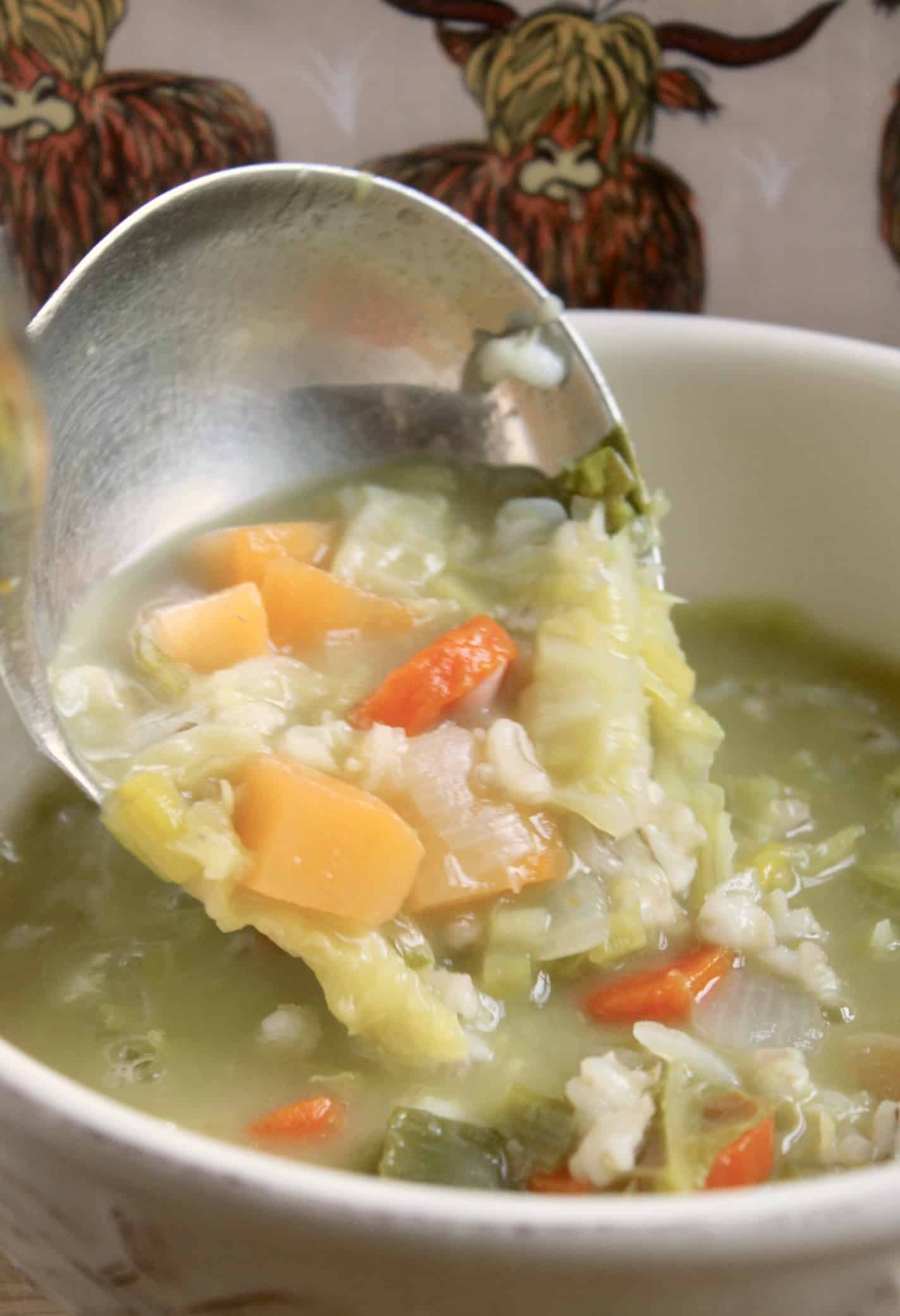 ladling Scotch soup into bowl