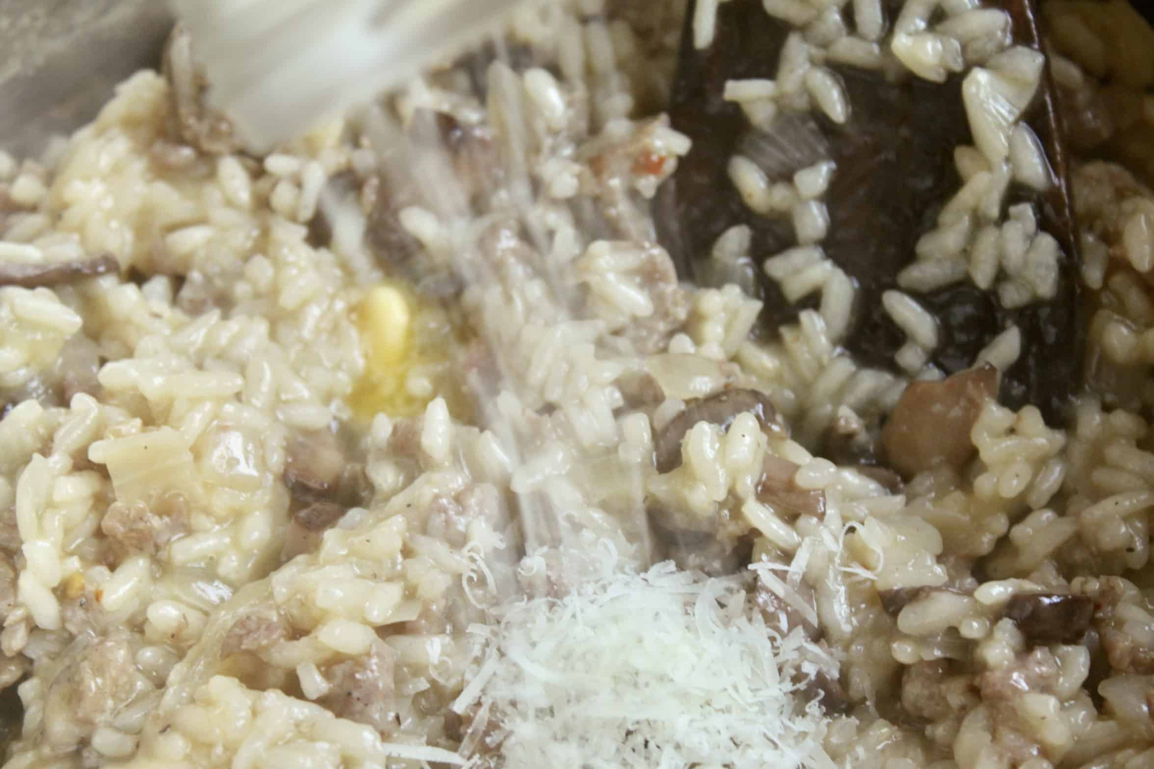 adding Parmigiano to risotto