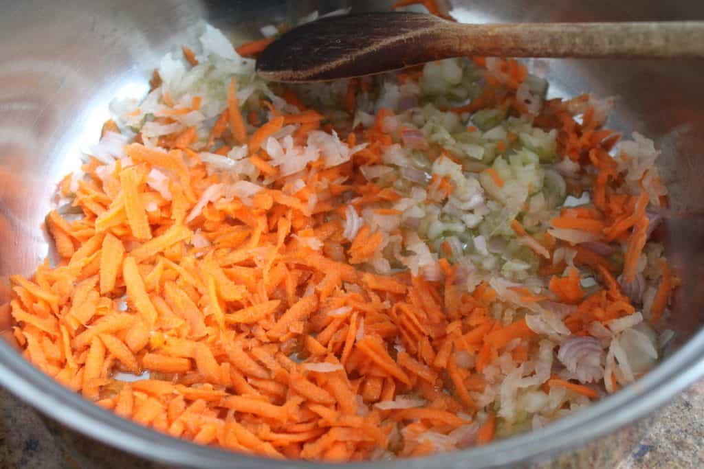 adding carrot to the pot
