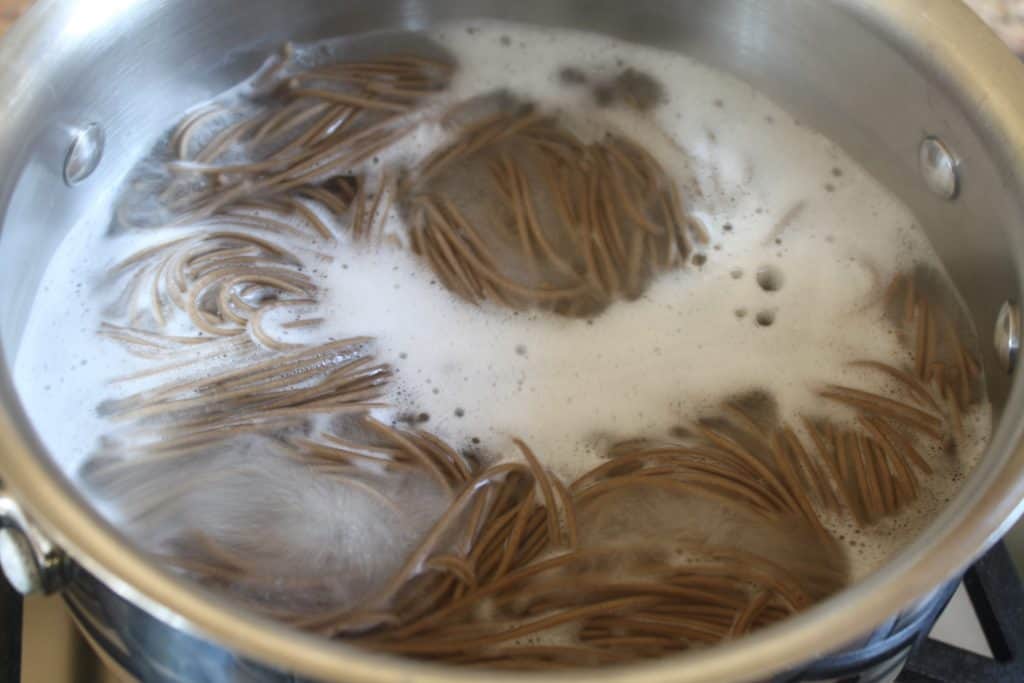 soba noodles in boiling water
