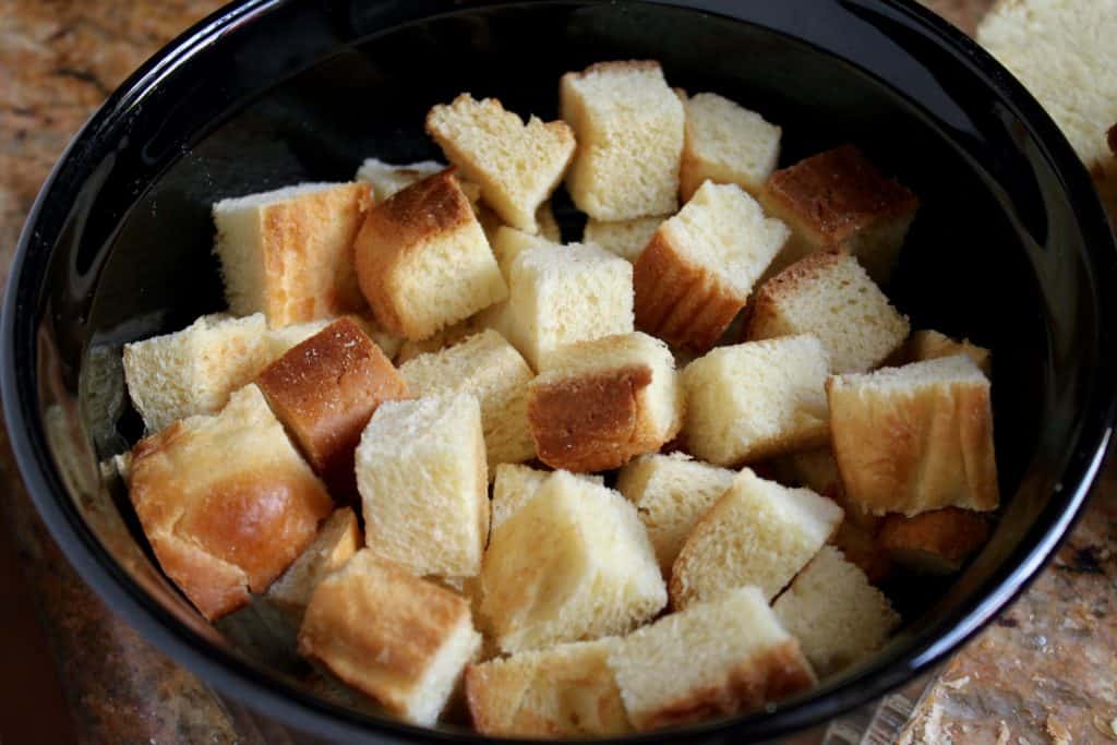 cubes of brioche bread in a black dish
