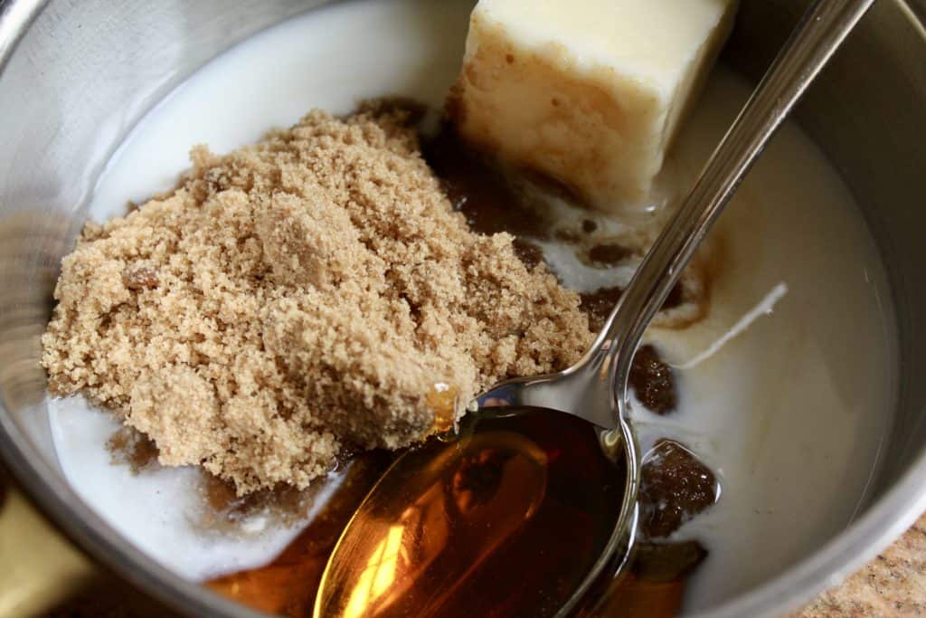 making the whisky sauce with syrup, brown sugar butter and cream