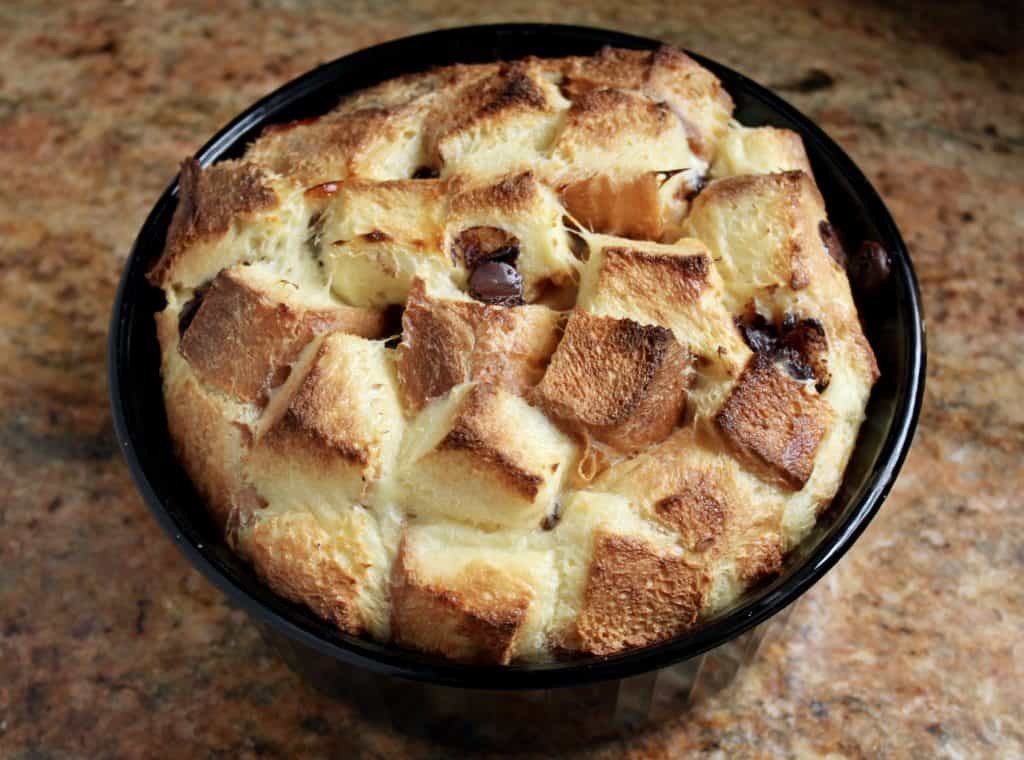 puffy Chocolate bread and butter pudding in a black dish