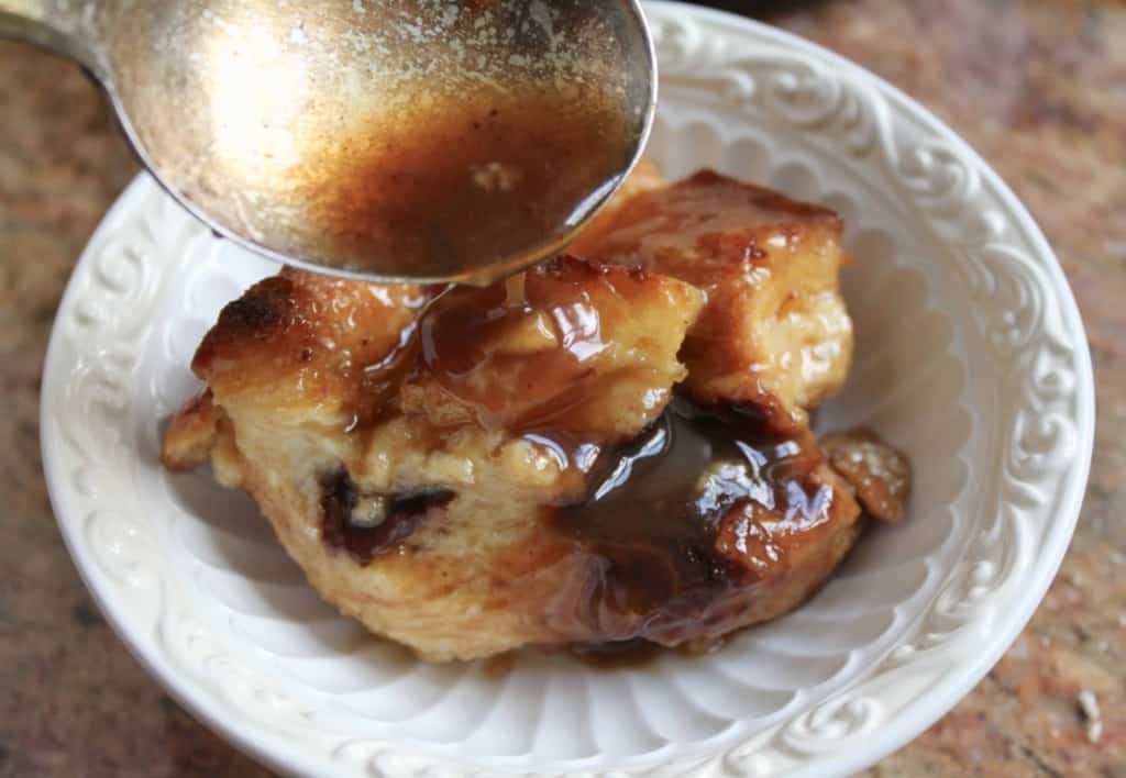 Chocolate bread and butter pudding with whisky sauce in a bowl