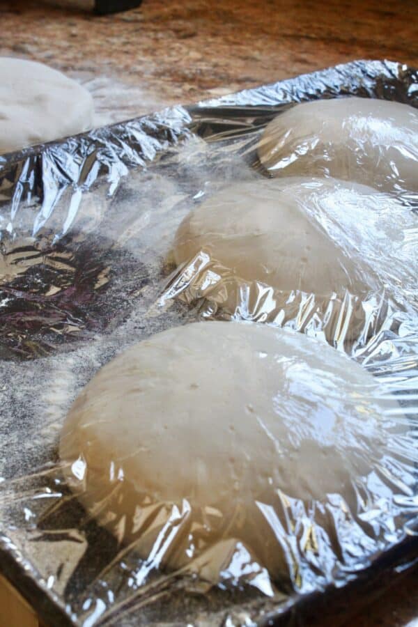 risen homemade pizza dough balls