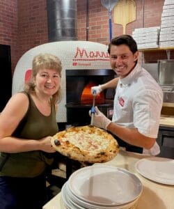 Christina Conte and Vito Iacopelli with pizza