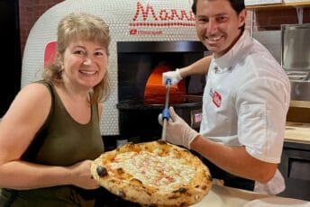 Christina Conte and Vito Iacopelli with pizza