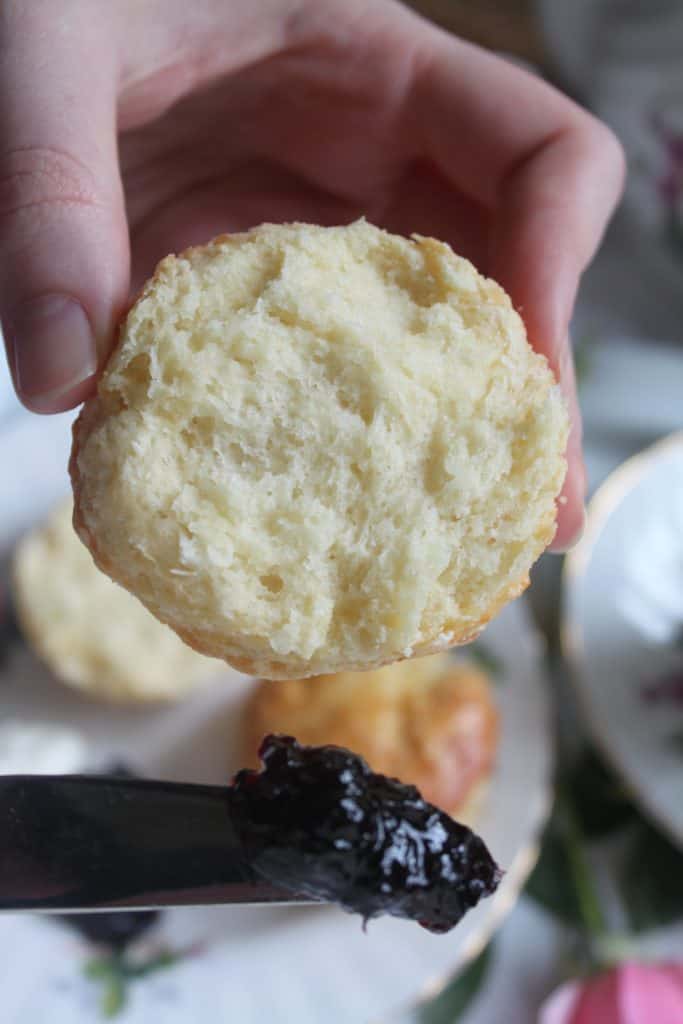 half an afternoon tea scone with jam