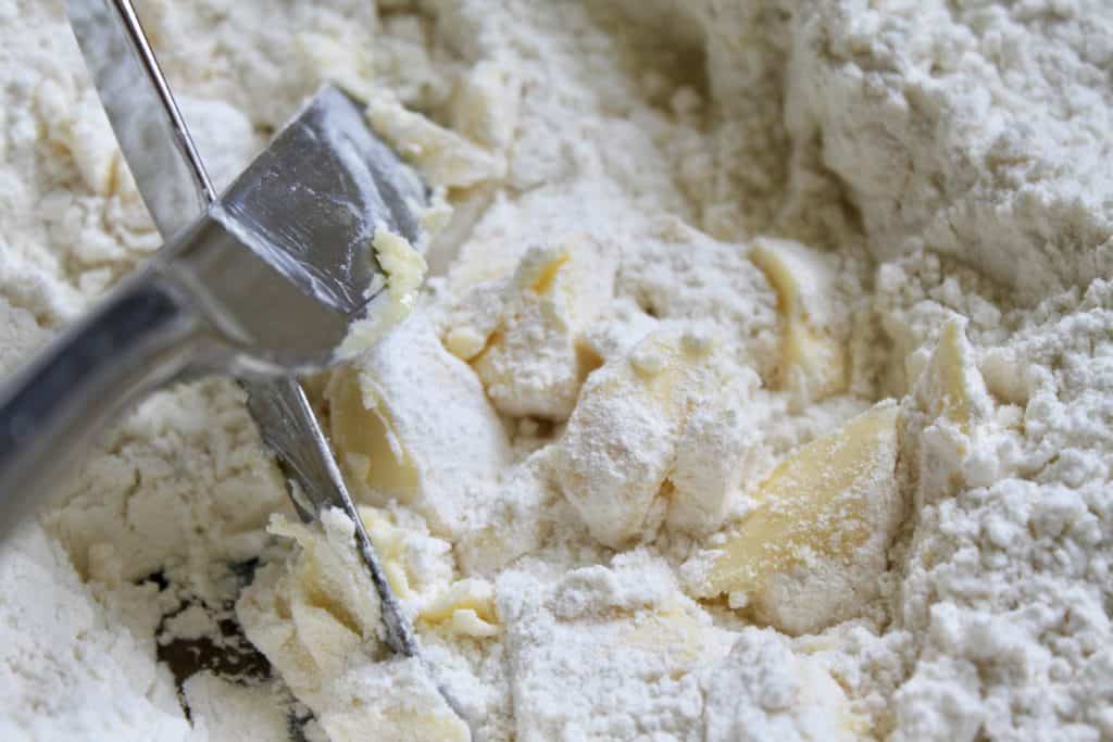 Cutting butter into flour for scones