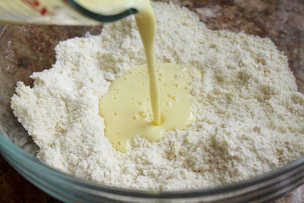 Pouring liquid into scone mixture