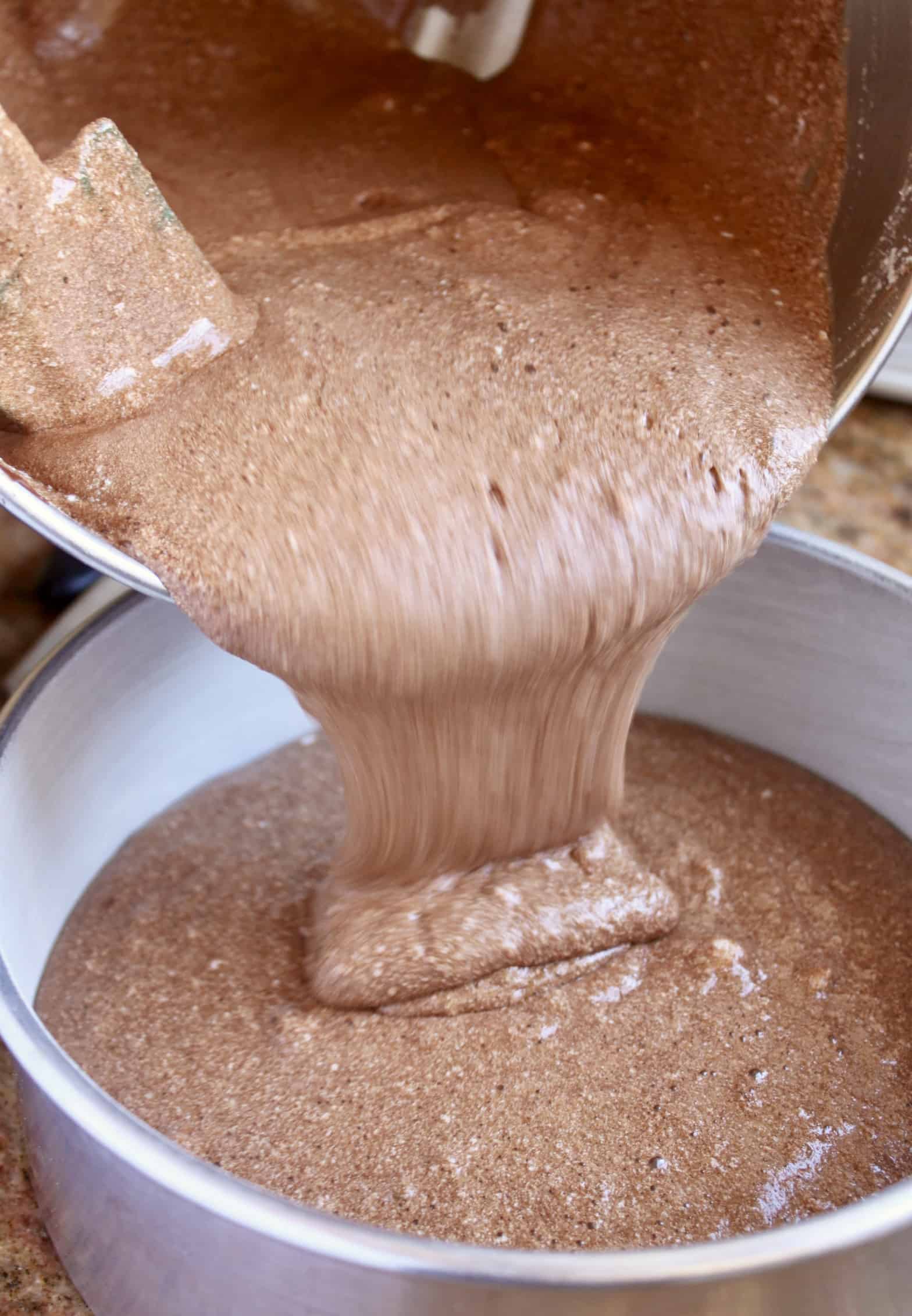 pouring flourless chocolate torte batter into pan