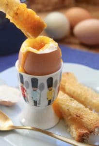 Soft boiled egg and soldiers