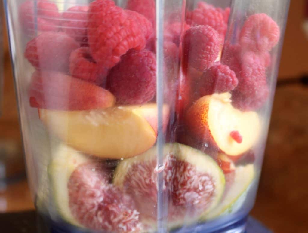 fig nectarine and raspberries in a blender