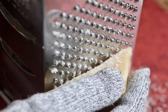 grating Pecorino Romano cheese