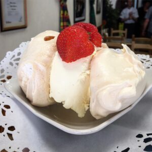 meringues sandwiched together with thick cream
