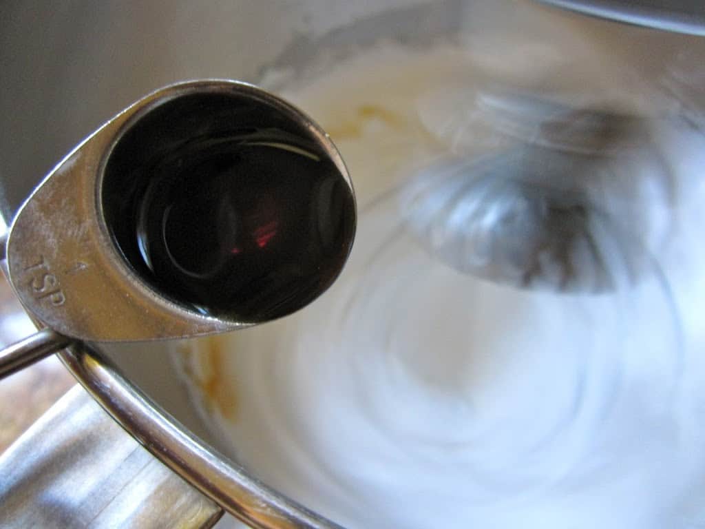 adding vanilla to beaten egg whites and sugar