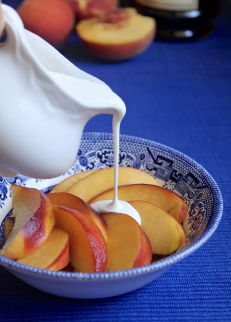 pouring cream on Peaches and cream and cognac