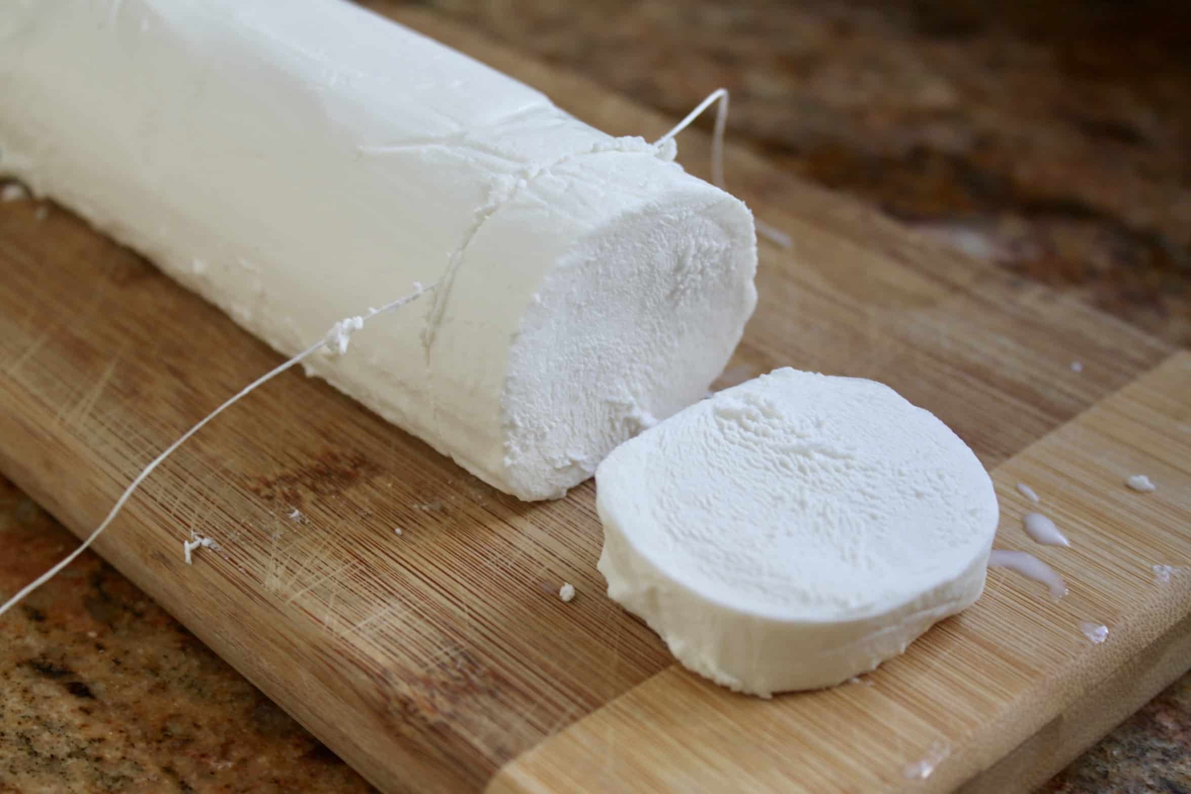 using dental floss to slice goat cheese