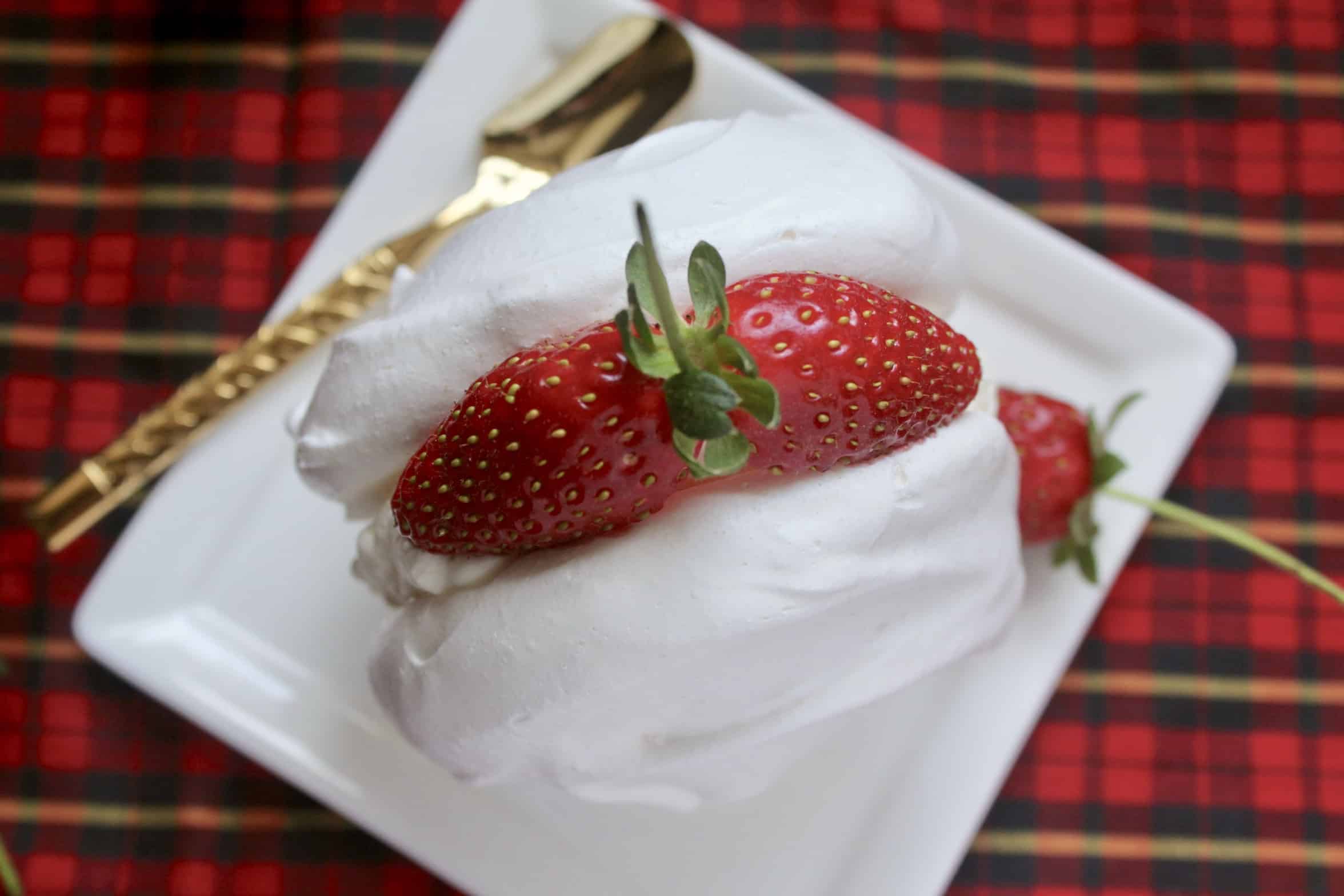 cream meringue with a strawberry