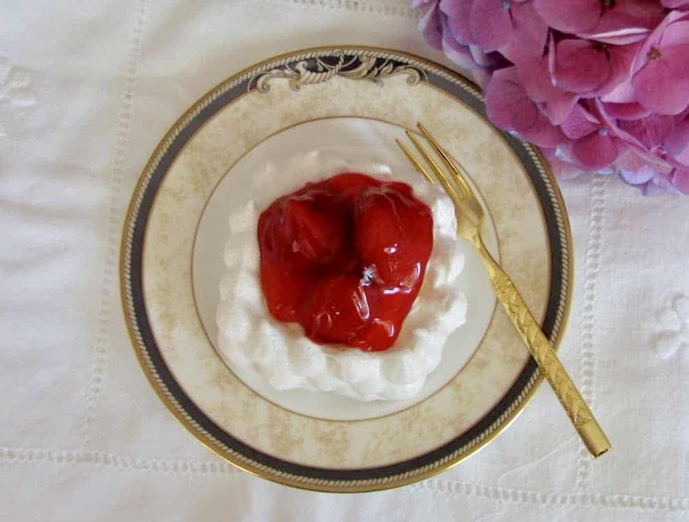 strawberries and cream in meringue nest