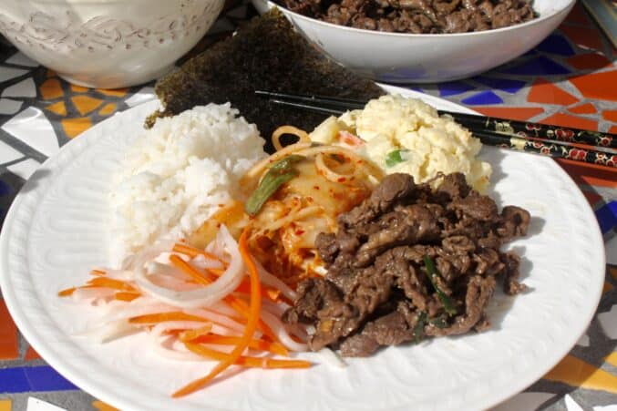 bulgogi on a plate with banchan