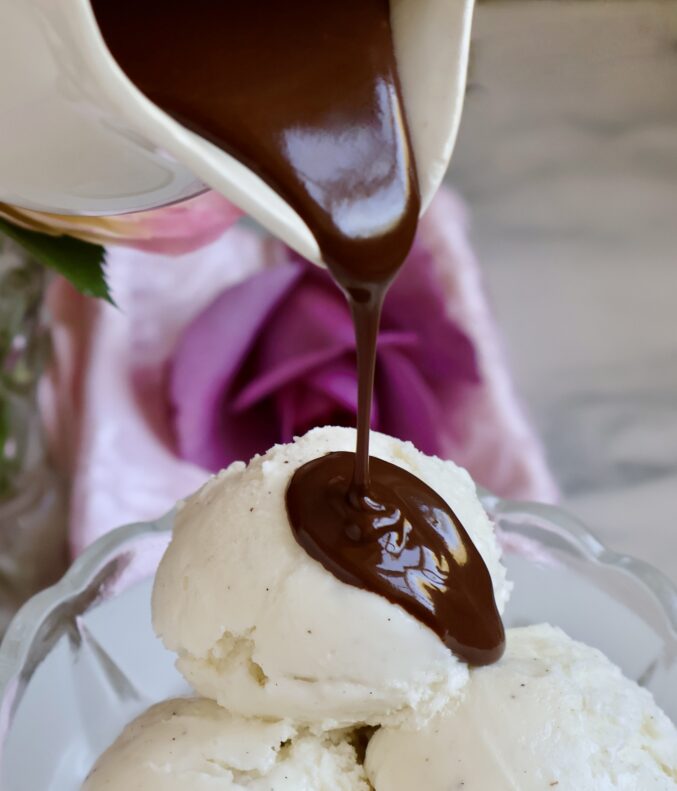 close up pouring chocolate shell