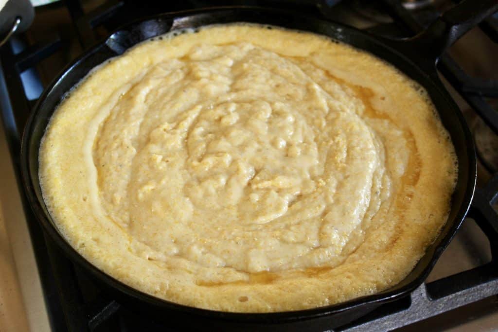 raw batter in a cast iron skillet