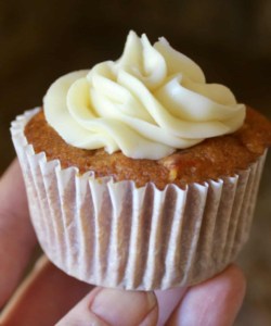 photo of hand with pumpkin muffin