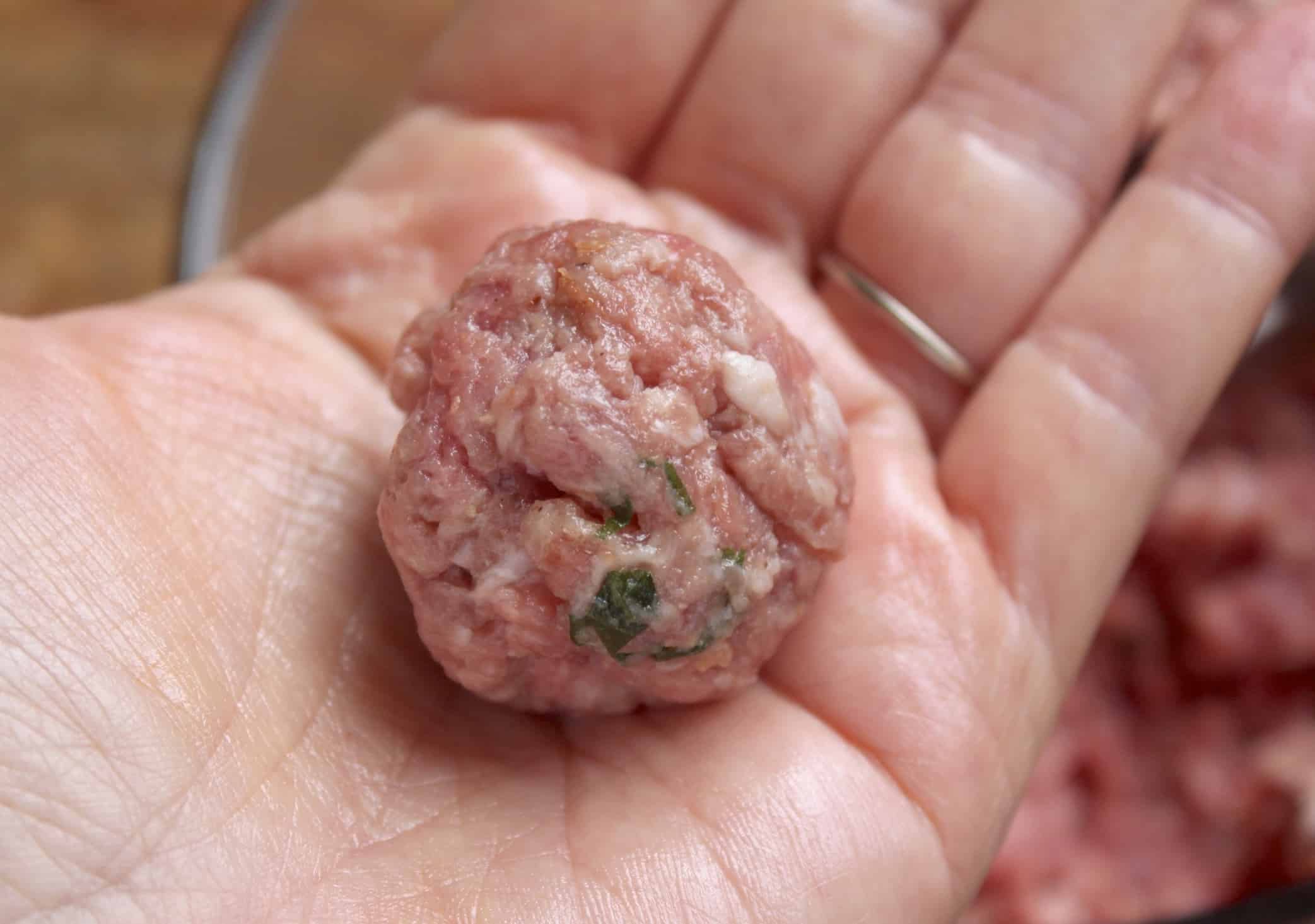shaping meatballs, meatball on a hand