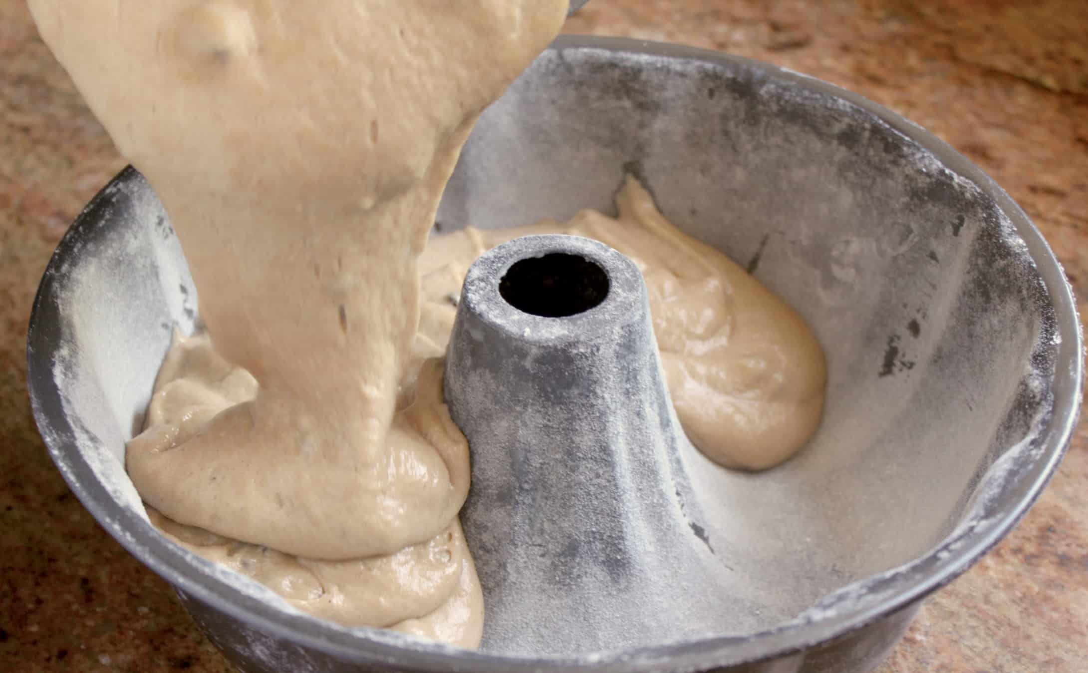 election cake batter being poured into a bundt pan