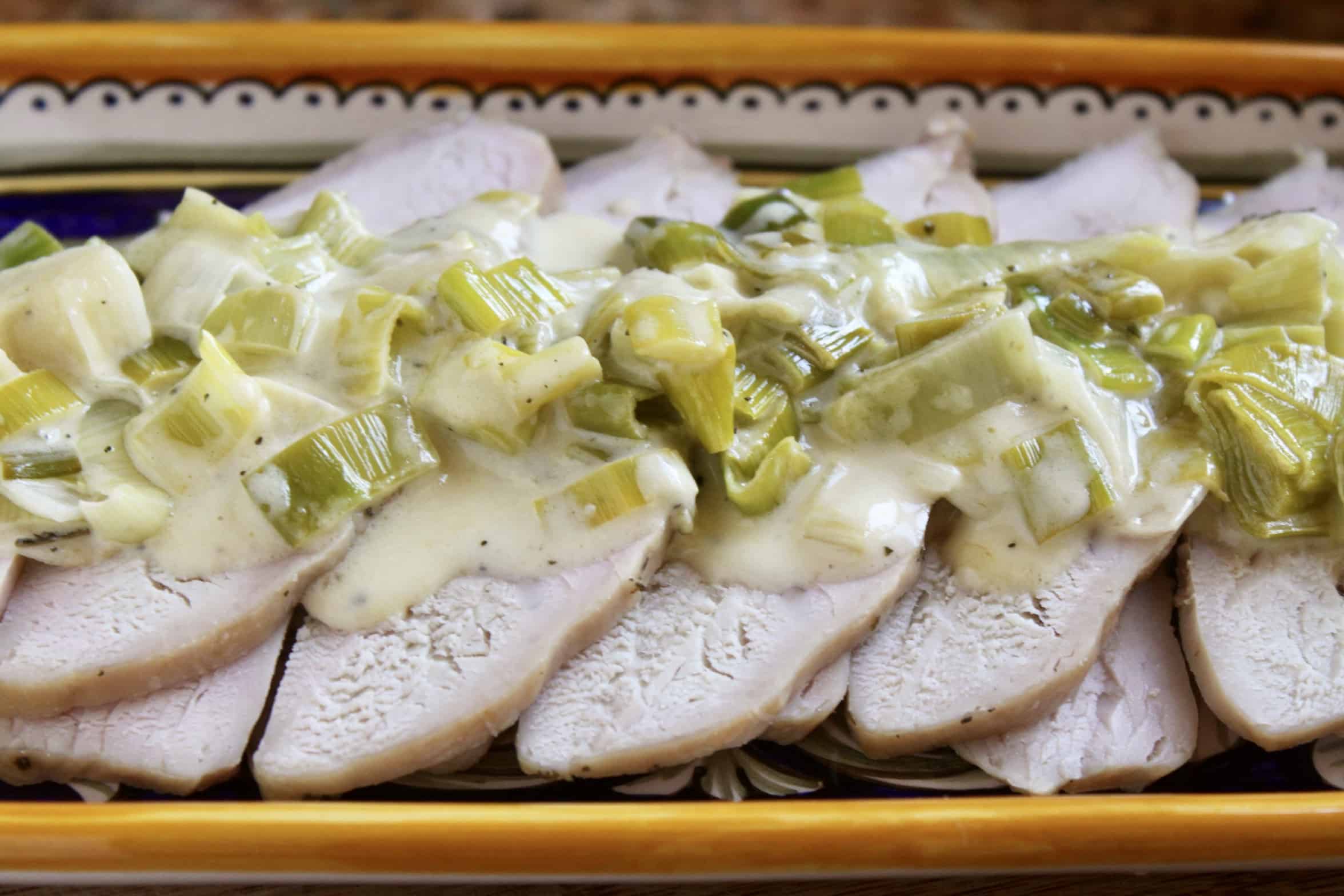 platter of turkey with leeks and butter sage sauce