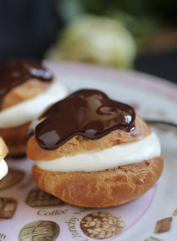 choux pastry filled with cream and topped with chocolate