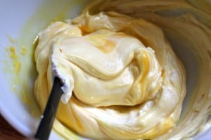 folding cream and Grand Marnier into custard