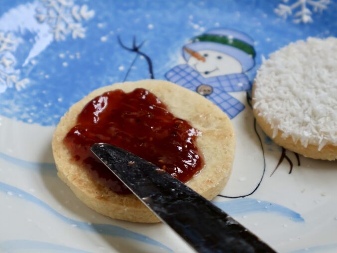 spreading raspberry jam