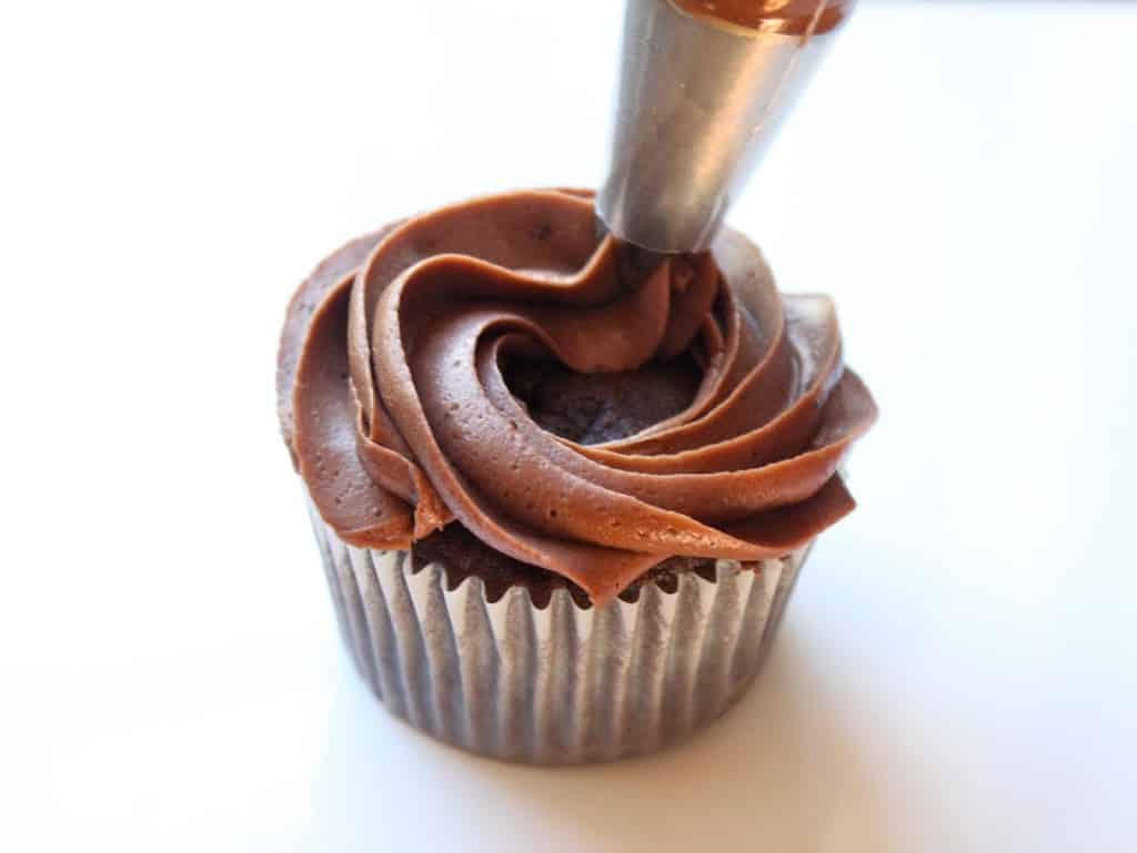 frosting a cupcake