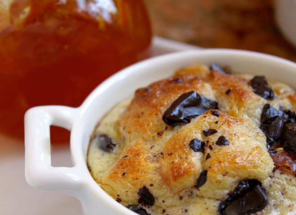 close up of chocolate and orange bread pudding in a ramekin