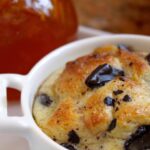 close up of chocolate and orange bread pudding in a ramekin