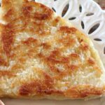 Irish or Scottish Soda Bread toasted and buttered on a plate.