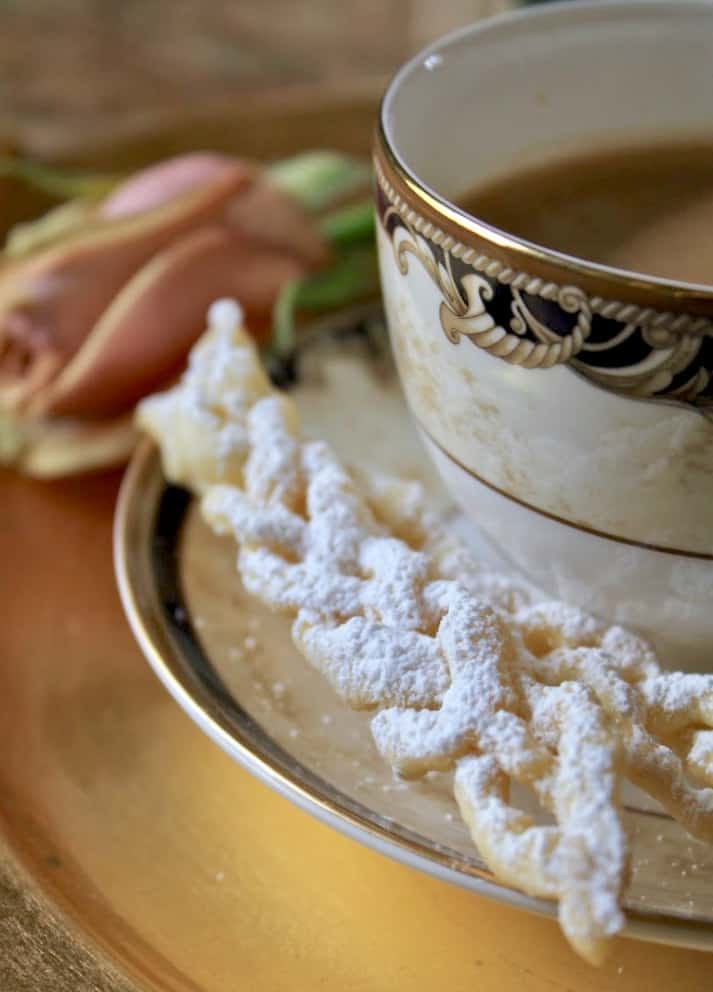 Wedgwood Cornucopia cup and saucer with an Italian bow tie cookie made like a braid cioffe