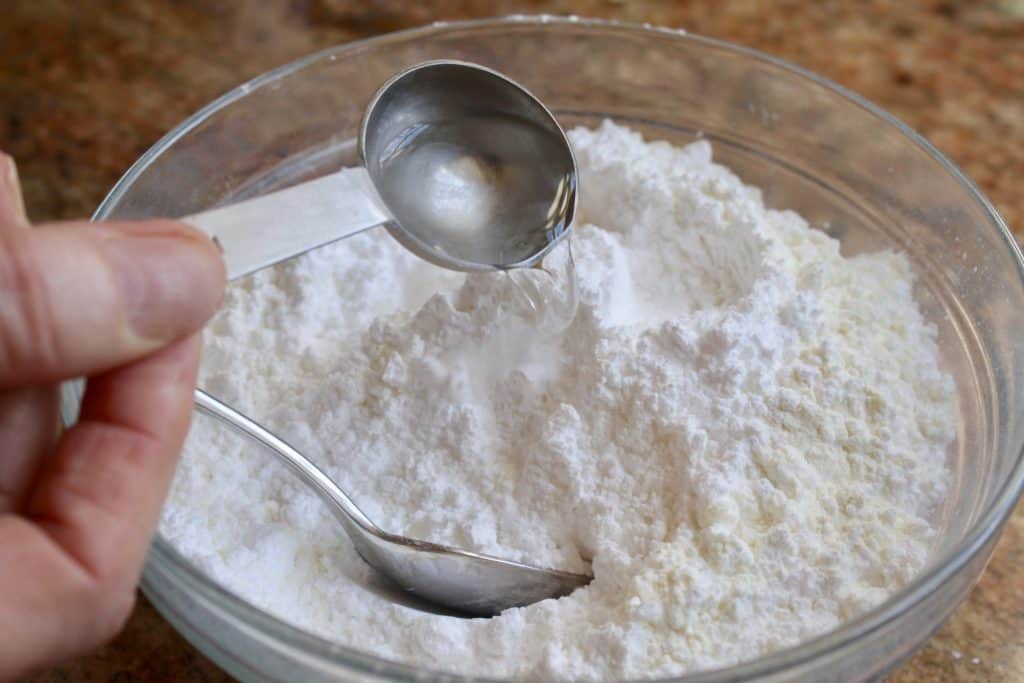 making icing for flower Easter cookies