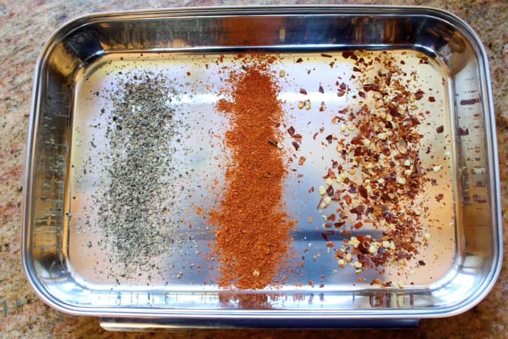 three types of pepper in a tray