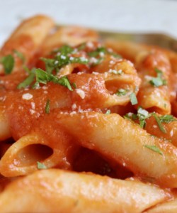 penne alla vodka with cheese and parsley