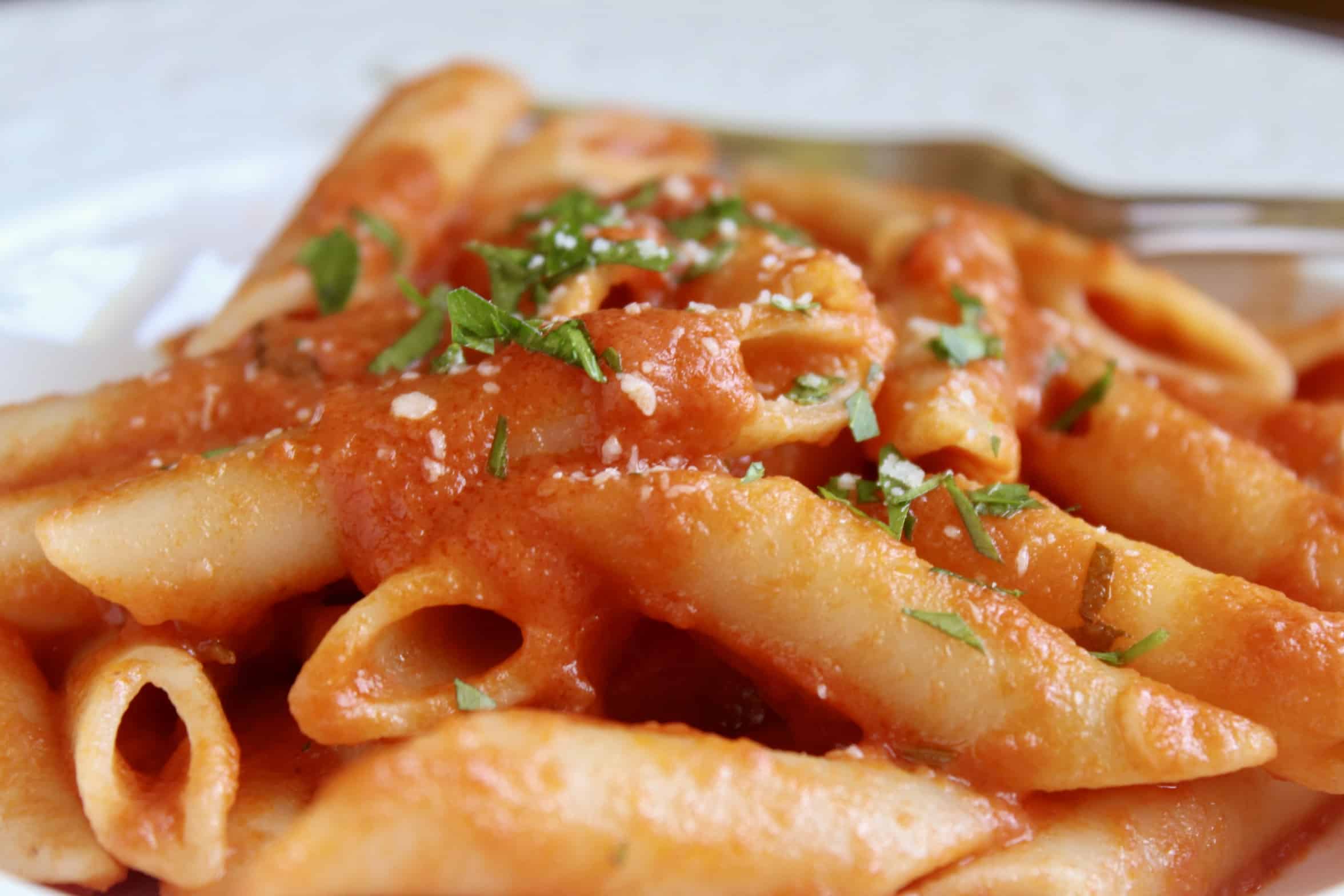 penne alla vodka with cheese and parsley