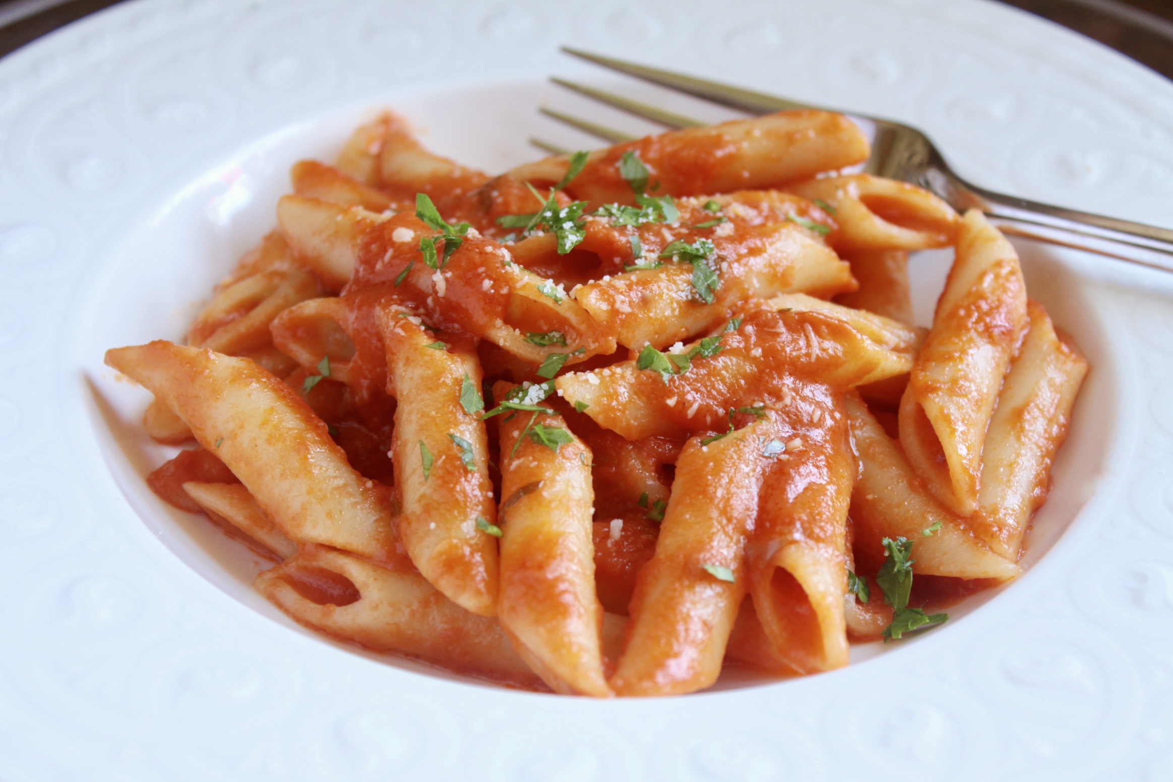 penne alla vodka with cheese and parsley