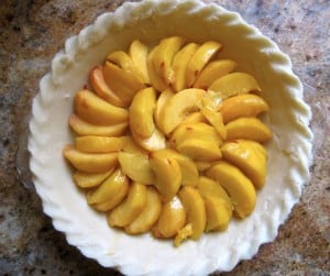 peaches in a raw pie crust