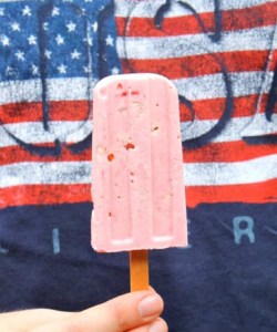 boy holding a popsicle wearing a USA t shirt