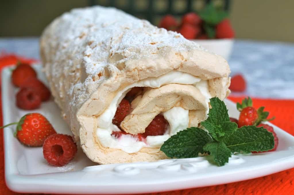 strawberry meringue roulade dessert with mint