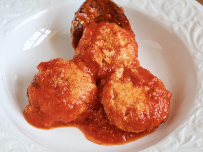 three cheese dumplings in a plate